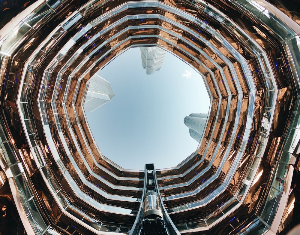 low-angle photography of high-rise glass building