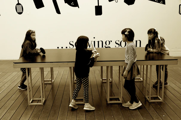 An interactive children’s workshop with families engaged around a table.