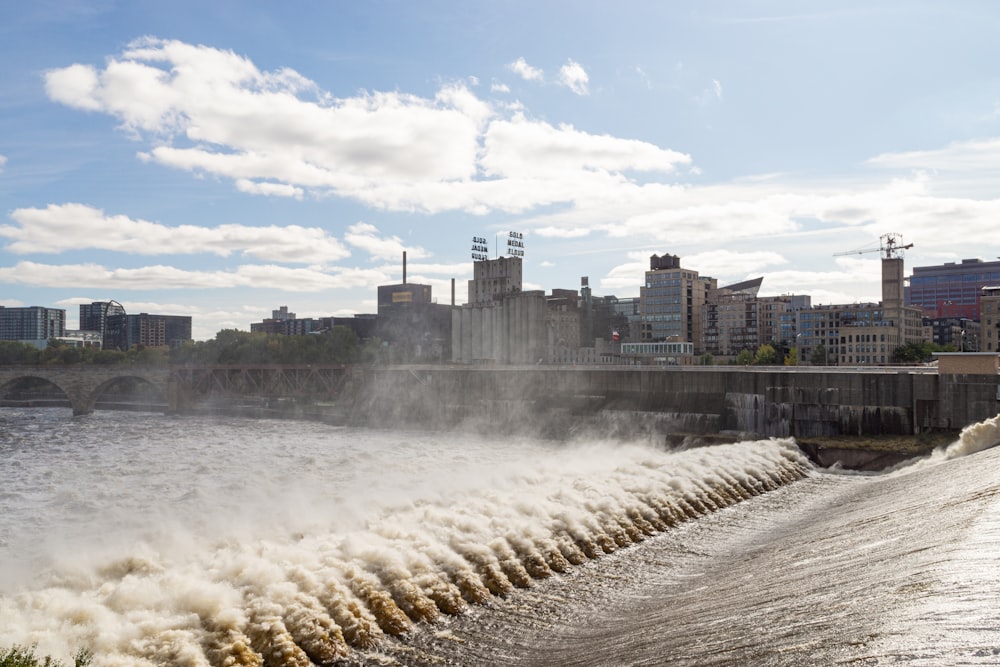 water from dam in front of buildings