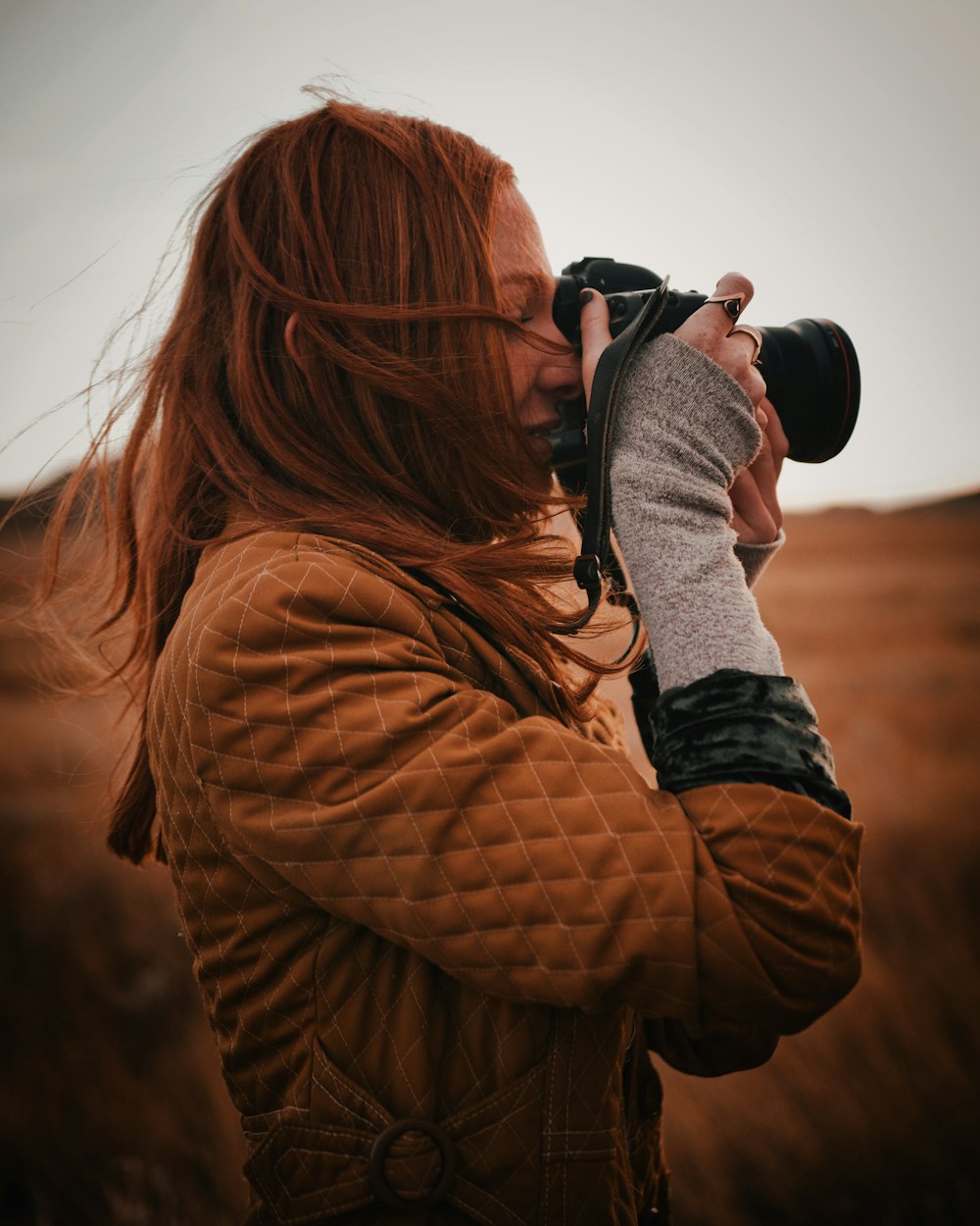 woman using a DLSR camera