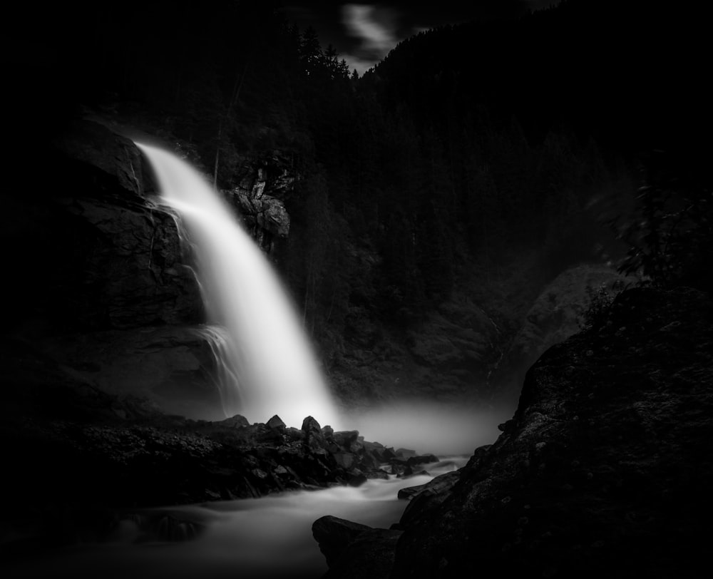 grayscale time lapse photography of flowing waterfall