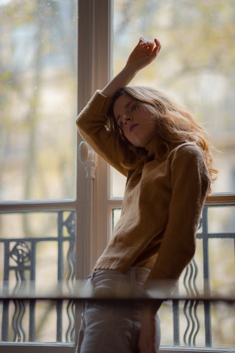 woman in a brown sweater