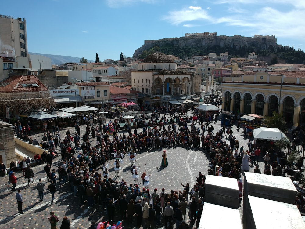 group of people watching a musician performing