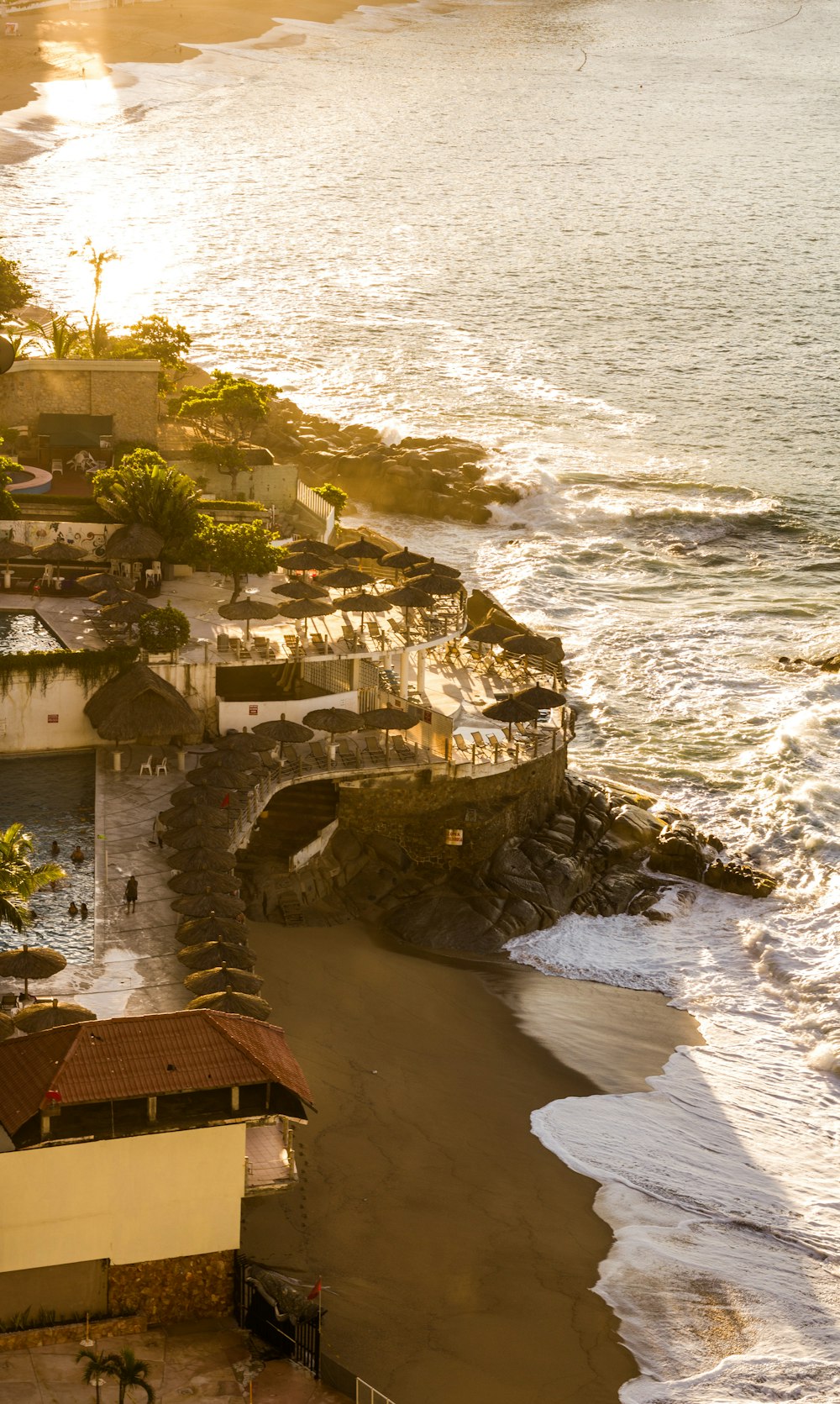 black umbrella resort by a beach