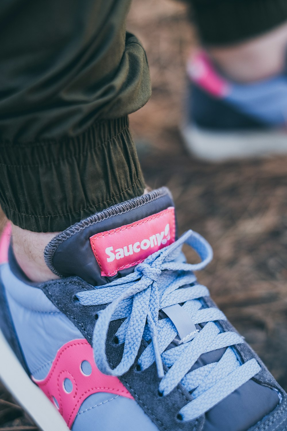 blue, gray, and pink Saucony sneaker