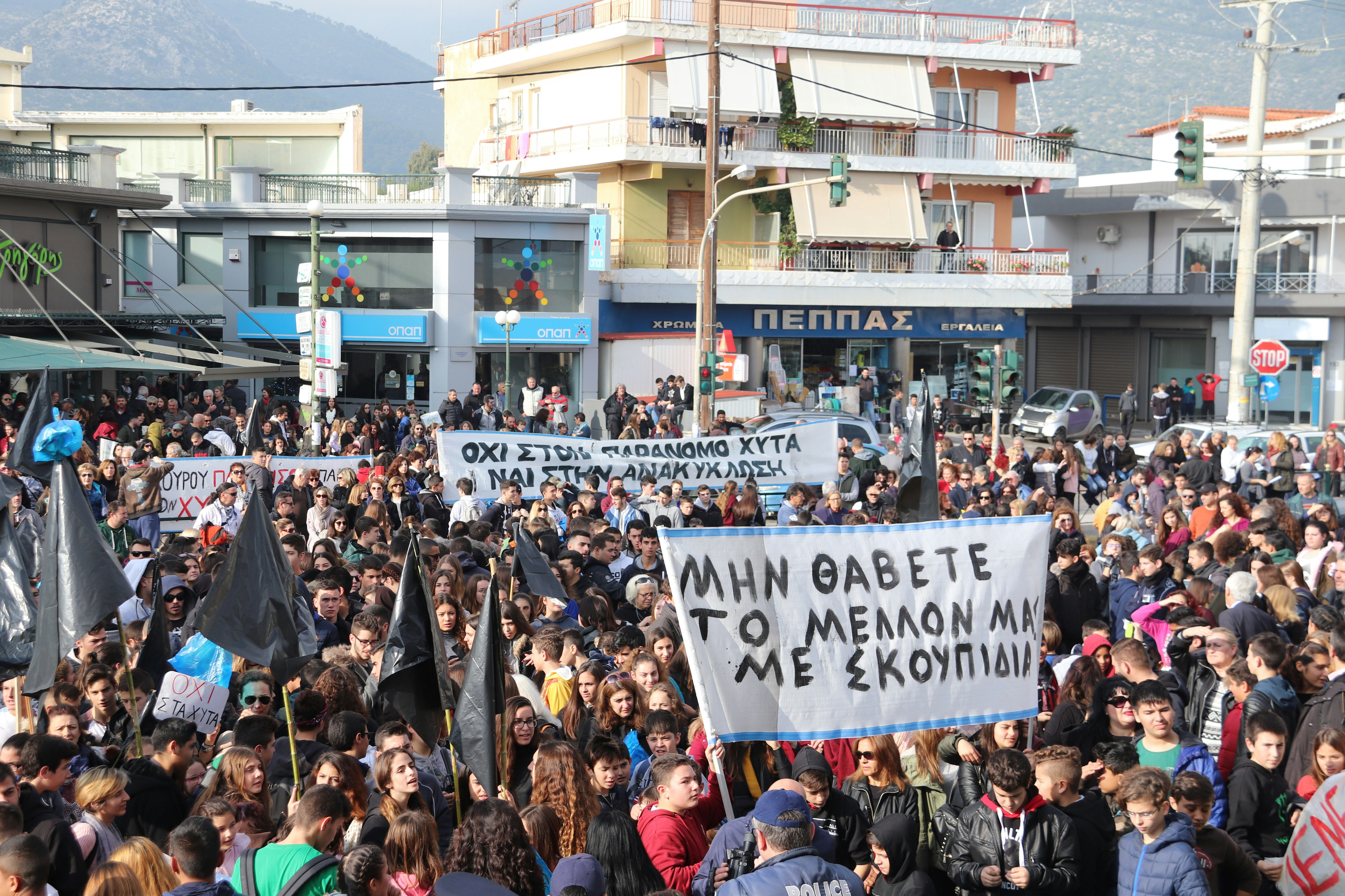 people gathered in the streets in a rally
