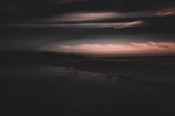 Dark, moody landscape with soft focus and cinematic atmosphere.