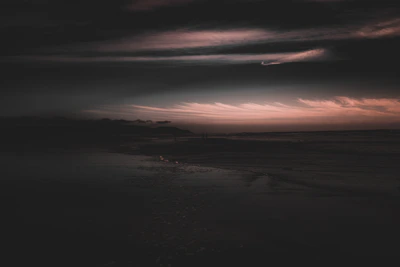 Dark, moody landscape with soft focus and cinematic atmosphere.