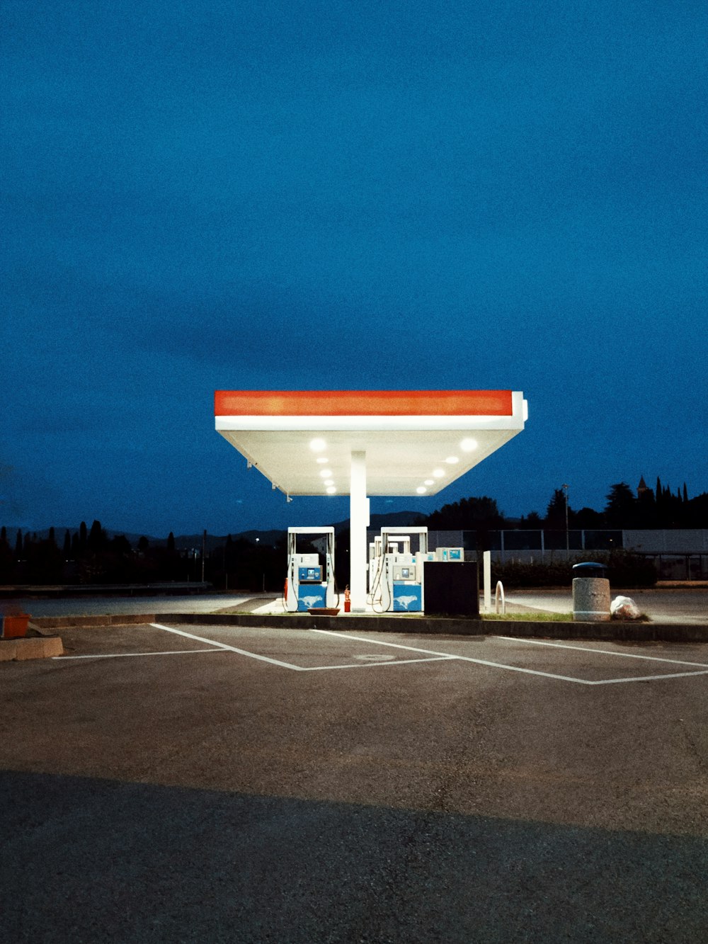 white and red gasoline station