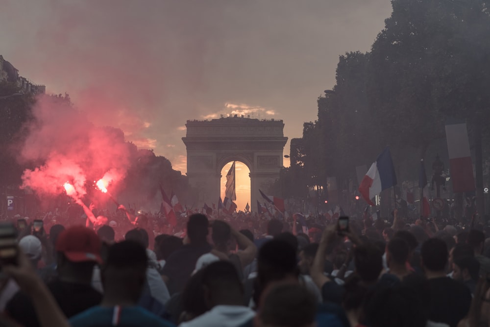 people gathering near arch gate