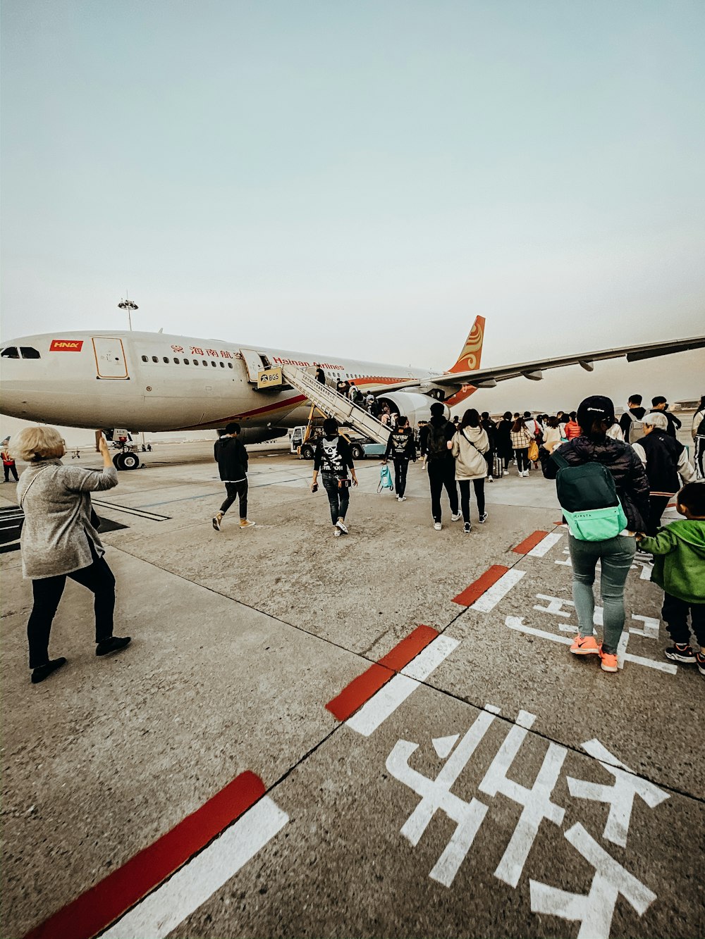 people standing near airplane