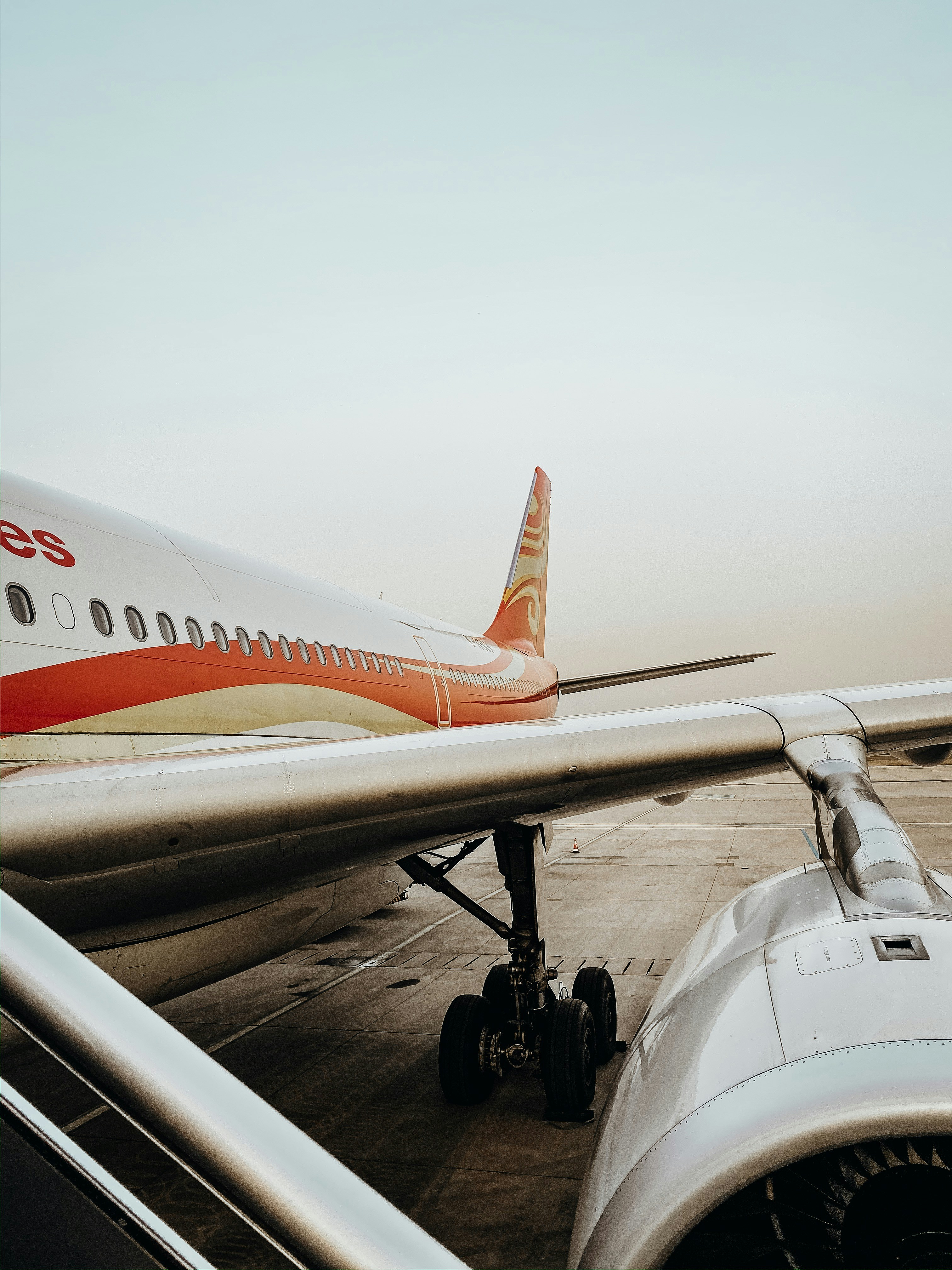 white and orange domestic airplane