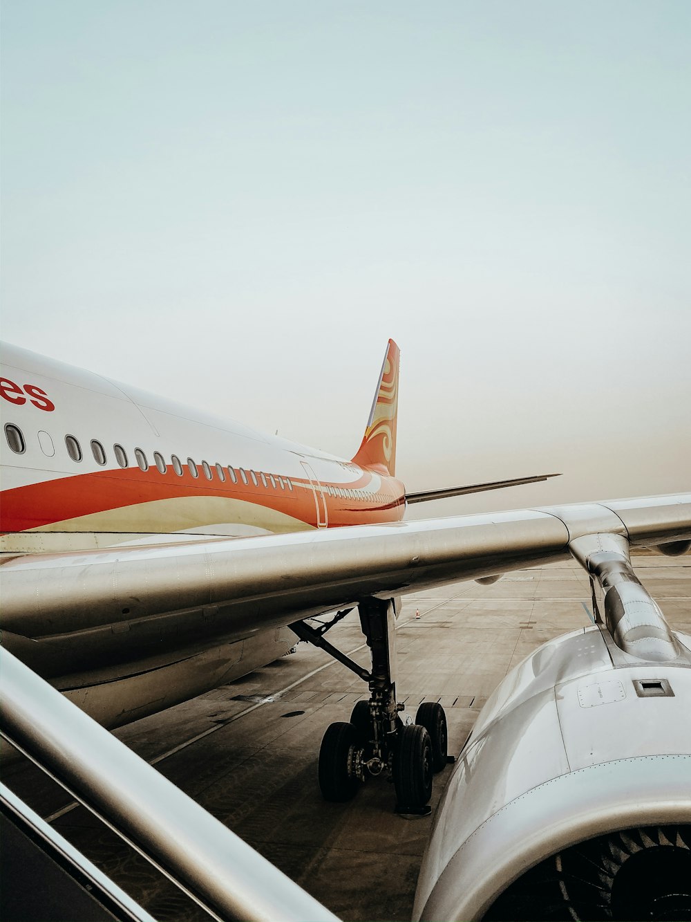 white and orange domestic airplane