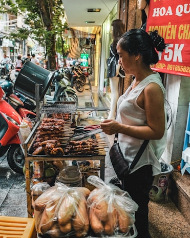 A friendly vendor unloading fresh chicken and assorted meats from a van at a neighborhood street.