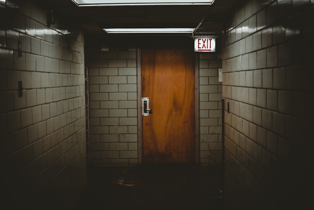 shallow focus photo of brown wooden door