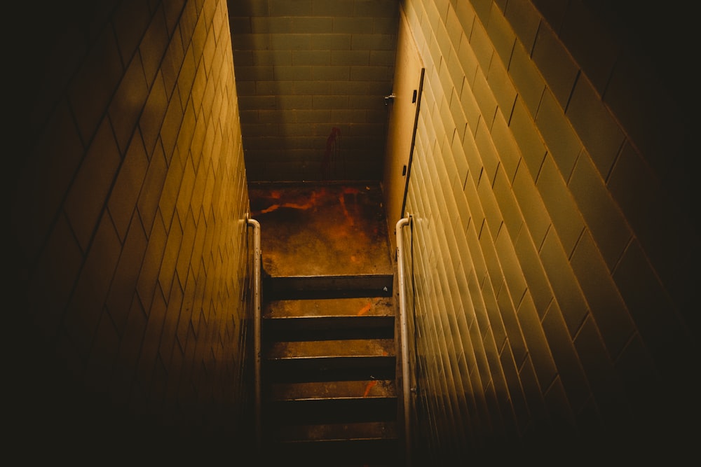 narrow brown concrete staircase