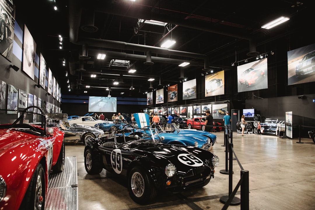 different vehicles in a car show inside building