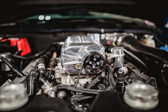 shallow focus photo of car engine bay