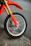 Close-up of a shiny new motorcycle tire mounted on a sleek bike.