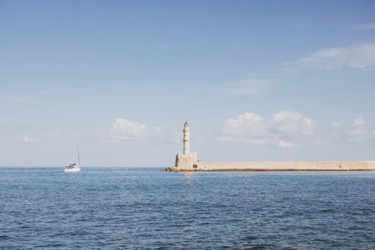white lighthouse scenery in Old Venetian Harbour Greece