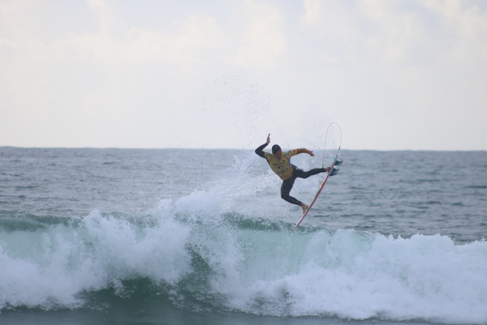 man surfing on sea