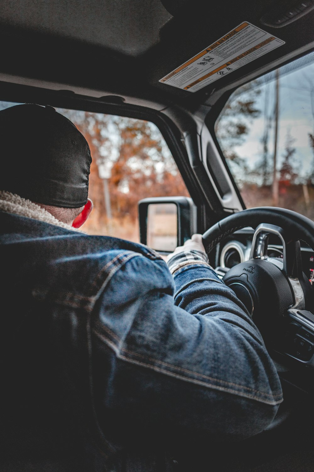 man in blue denim jacket