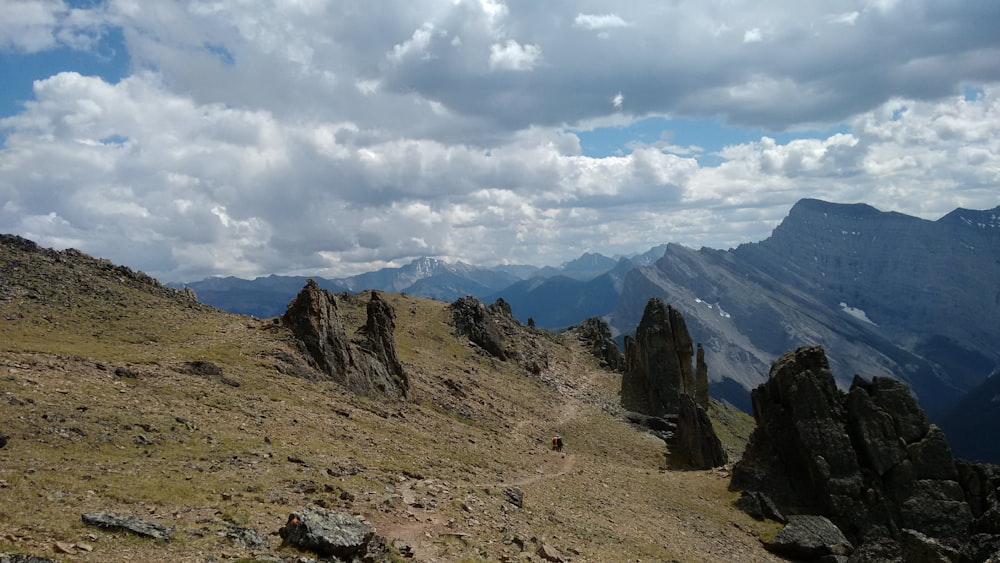 brown mountain under white clouds