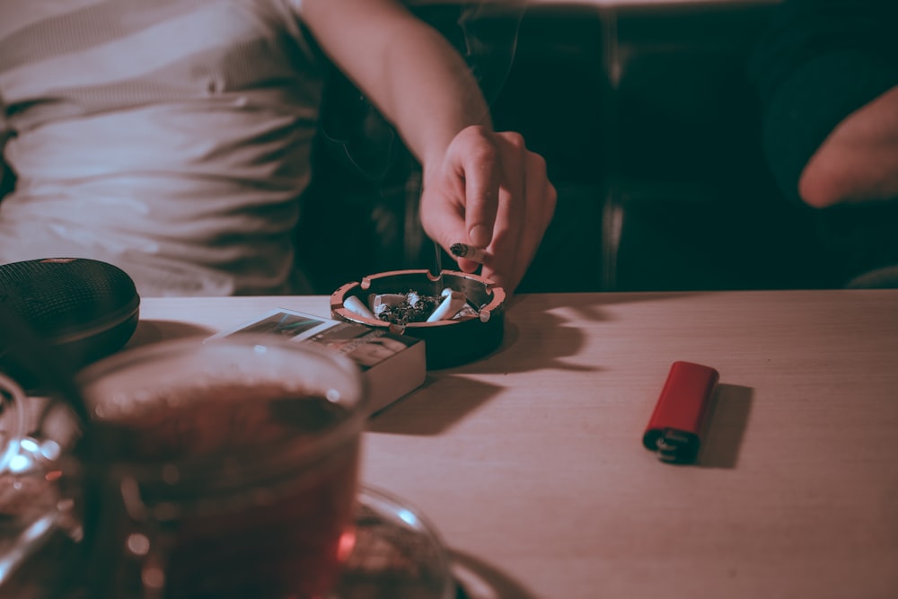 black ashtray on tabletop