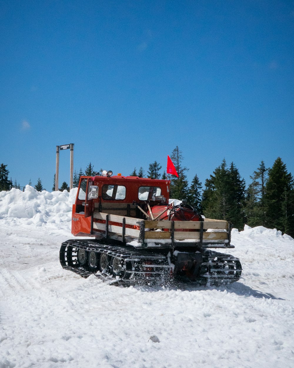 red and black snow truck
