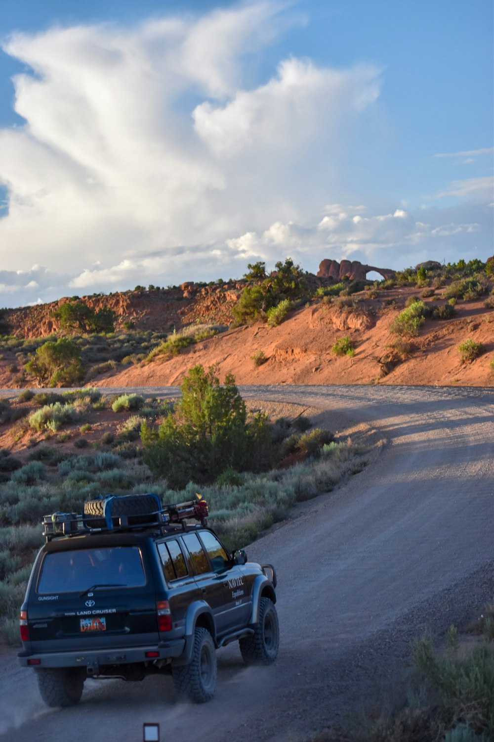 black off-road vehicle on asphalt road