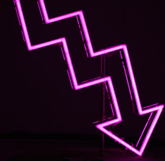 pink arrow neon sign