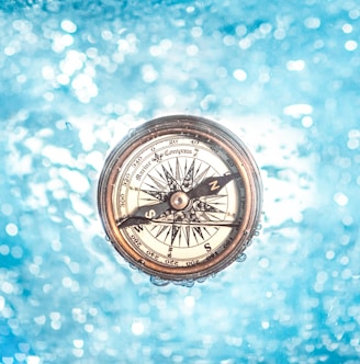 round gold-colored compass