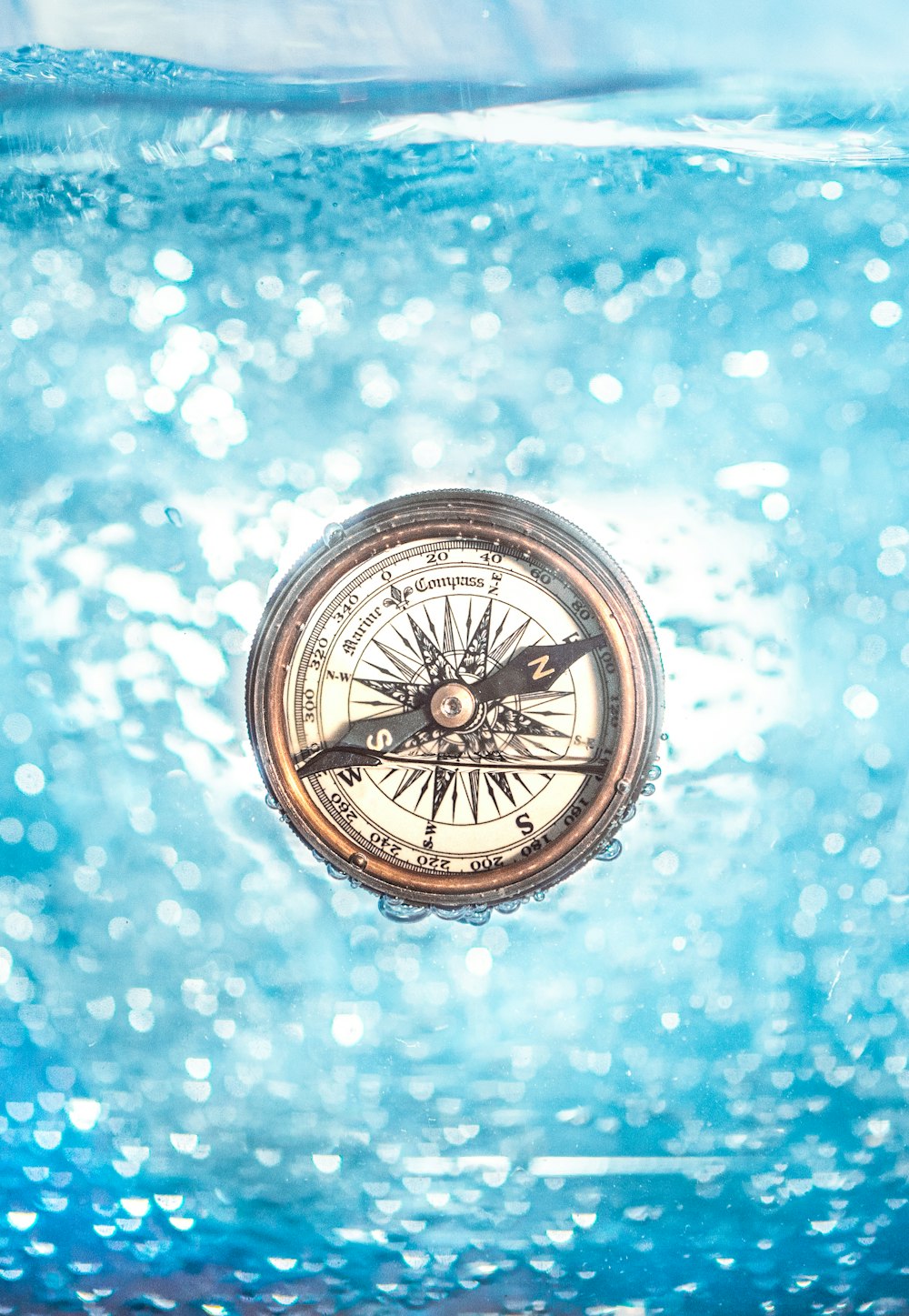 round gold-colored compass