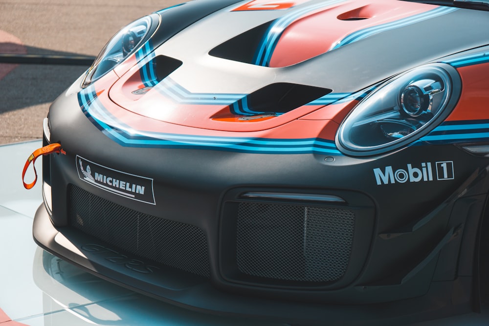 gray, orange, and blue Michelin vehicle