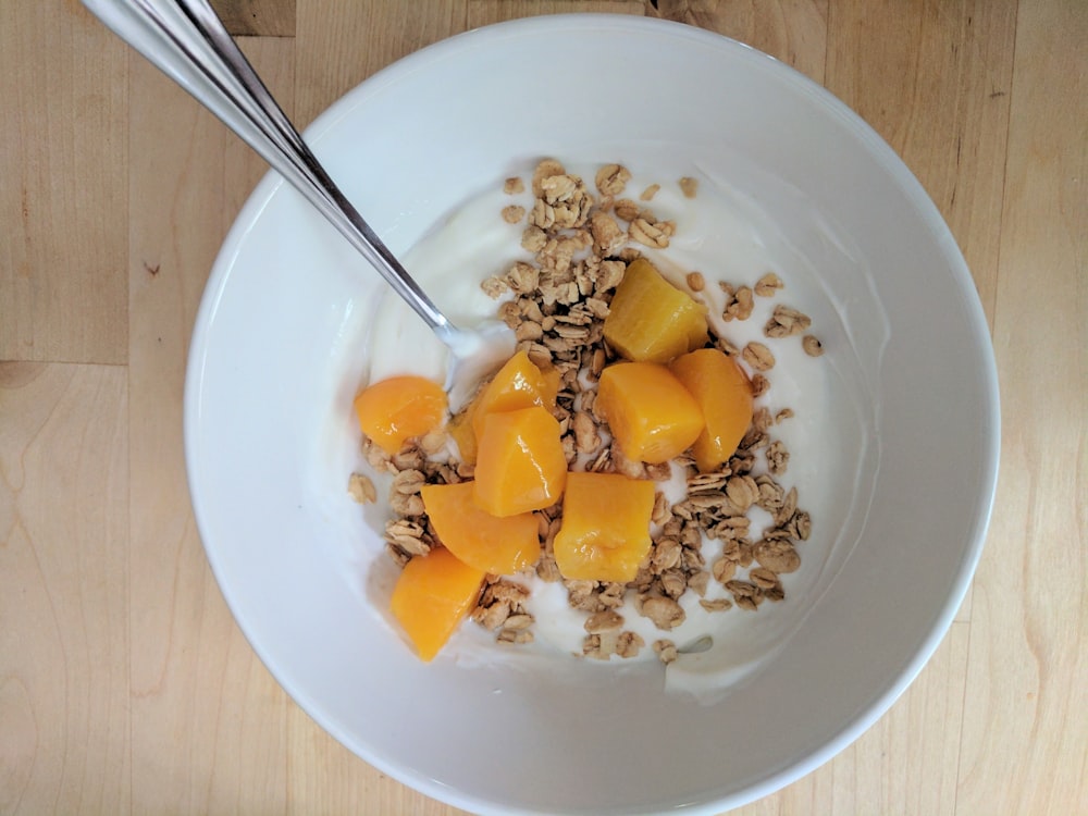 cereal with milk in ceramic bowl