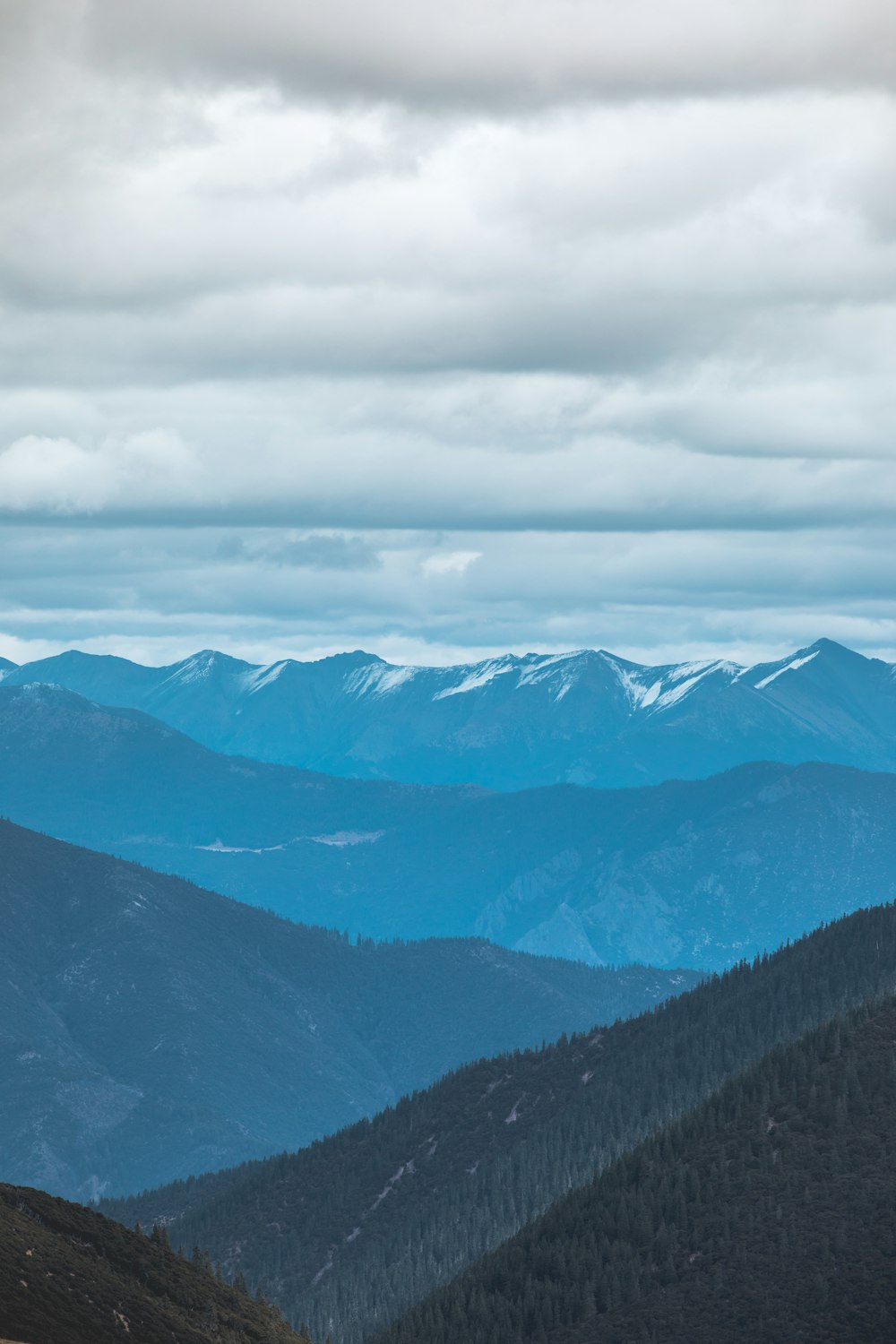 mountains under white clouds