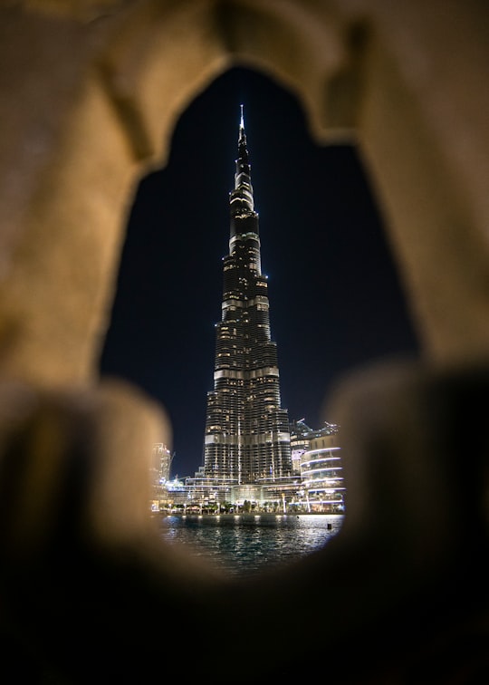 architectural photography of lighted city building in Burj Khalifa Lake - Dubai - United Arab Emirates United Arab Emirates