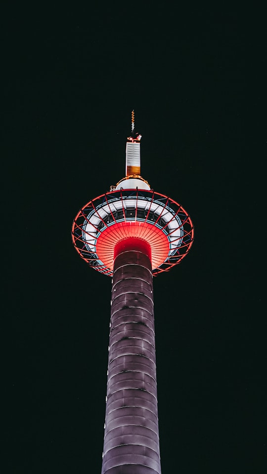 gray and orange cement tower in Kyoto Tower Japan