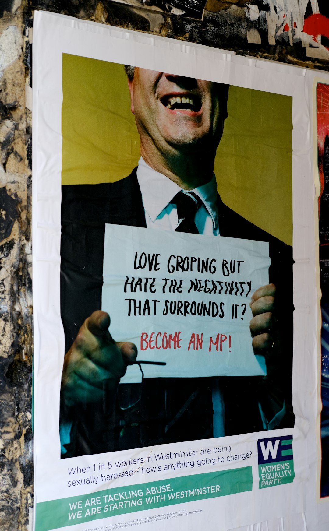 poster of man holding a white paper signage