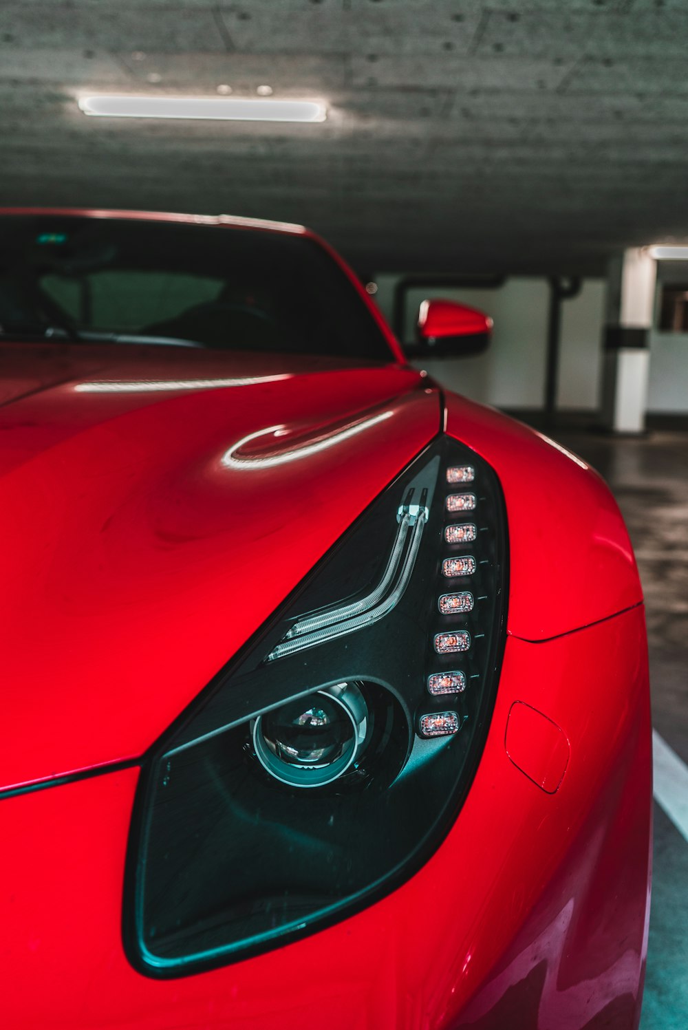 shallow focus photography of red car