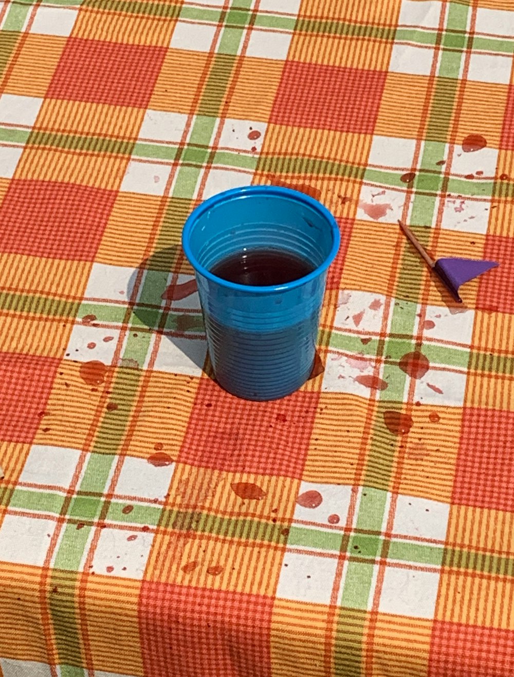 blue cup on table