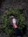 A happy customer wearing Voltz Steps shoes while walking in a park.