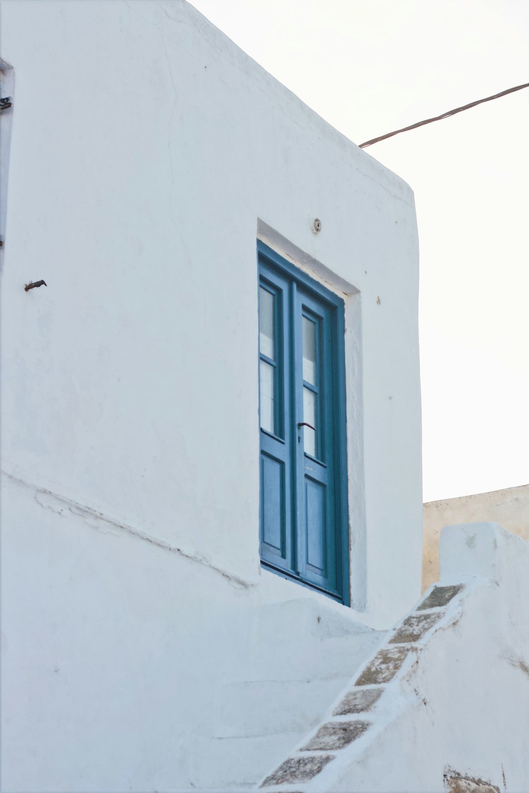 view of white painted house with closed door