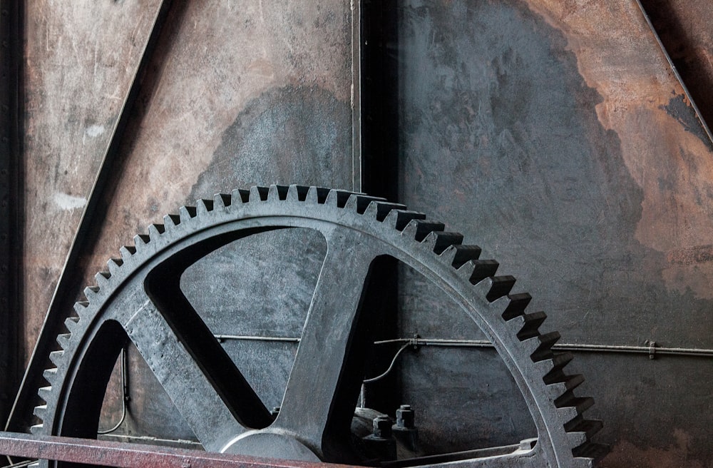 a close up of a large metal gear wheel