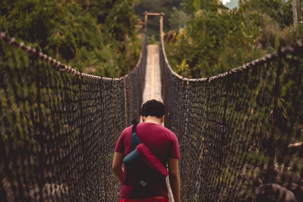 man walking in bridge