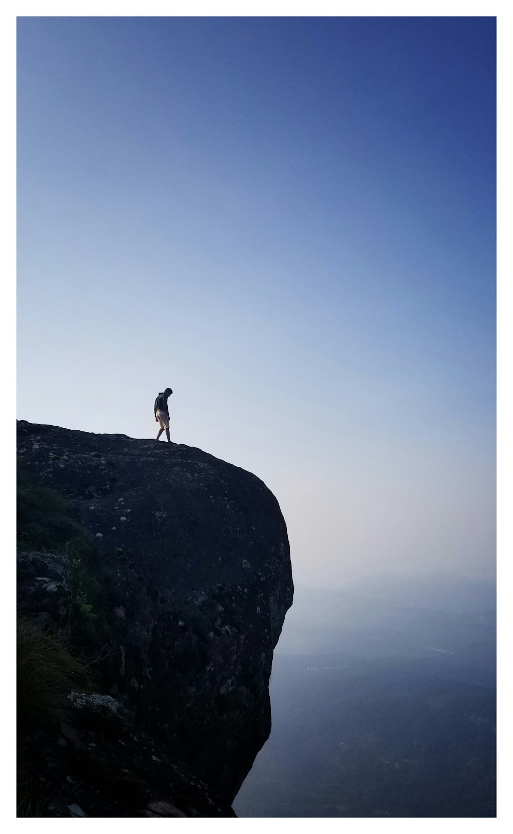 person standing on cliff