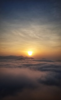 An inspiring scene of a sunrise over a mountain, representing new beginnings.