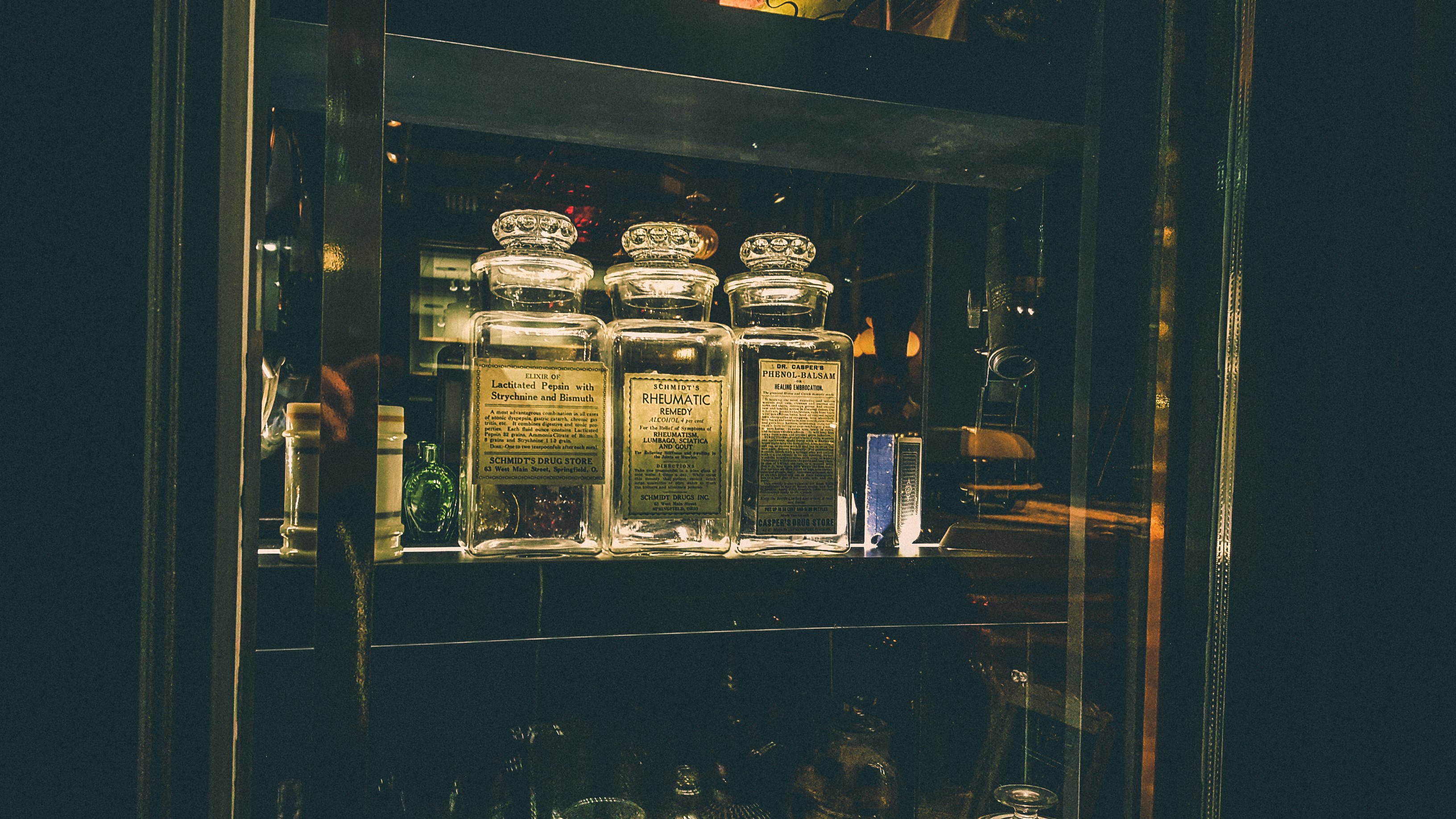 clear glass jars inside display cabinet