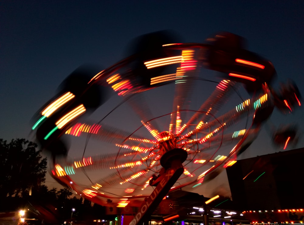 theme park ride in timelapse photography at nighttime