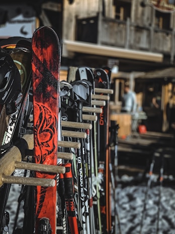 A close-up of high-quality winter sports equipment arranged neatly on a wooden surface.